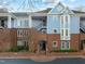 Three-story building, brick and blue exterior, multiple entrances at 243 New Bern Pl # 301, Raleigh, NC 27601