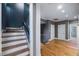 Upstairs hallway with hardwood floors and access to bedrooms and bathrooms at 255 Penley Cir, Raleigh, NC 27609