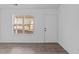 Bright entryway with wood floors, large window, and door at 2613 Lilymount Dr, Raleigh, NC 27610