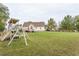 Spacious backyard with a playset and plenty of grass space at 270 W Silverado Ct, Kenly, NC 27542