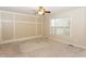 Spacious bedroom featuring a ceiling fan, plush carpeting, and a large window for natural light at 270 W Silverado Ct, Kenly, NC 27542