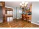 Dining area showcasing hardwood floors, stainless appliances and kitchen, and connection to living room at 270 W Silverado Ct, Kenly, NC 27542