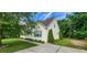 Side view of a charming home with blue shutters and landscaped walkway at 270 W Silverado Ct, Kenly, NC 27542