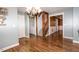 Hallway with hardwood floors and access to a laundry room, stairs and other rooms at 270 W Silverado Ct, Kenly, NC 27542
