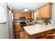 Spacious kitchen with stainless steel appliances, ample cabinet space, breakfast bar, and stylish decor at 270 W Silverado Ct, Kenly, NC 27542