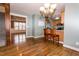 Kitchen and dining space with hardwood floors, stainless appliances, and breakfast bar seating at 270 W Silverado Ct, Kenly, NC 27542