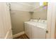 Laundry room features a washer, dryer, and wire shelving for storage at 270 W Silverado Ct, Kenly, NC 27542