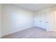 Bright bedroom with carpet, double door closet, and neutral walls at 308 Johnson Ridge Way, Four Oaks, NC 27524