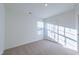 Bright bedroom with carpet flooring, window, and double door closet at 284 Johnson Ridge Way, Four Oaks, NC 27524