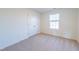 Spacious bedroom with carpet flooring, window, and closet at 308 Johnson Ridge Way, Four Oaks, NC 27524
