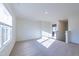 Spacious bedroom with large window and neutral decor at 308 Johnson Ridge Way, Four Oaks, NC 27524