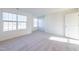 Well-lit bedroom with large window and neutral decor at 308 Johnson Ridge Way, Four Oaks, NC 27524