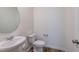 Simple half bathroom with pedestal sink and white toilet at 308 Johnson Ridge Way, Four Oaks, NC 27524