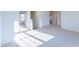 Luminous hallway with carpet and doors to bedrooms at 308 Johnson Ridge Way, Four Oaks, NC 27524