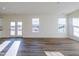 Spacious living area with hardwood floors and access to backyard at 308 Johnson Ridge Way, Four Oaks, NC 27524