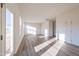 Spacious living area featuring hardwood floors and access to backyard at 308 Johnson Ridge Way, Four Oaks, NC 27524