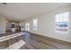 Open concept living room with kitchen view and hardwood floors at 308 Johnson Ridge Way, Four Oaks, NC 27524