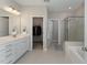 Double vanity bathroom with walk-in closet at 2901 Water Tower Ln, Apex, NC 27502