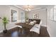 Bright dining room featuring hardwood floors and a modern table setting at 2901 Water Tower Ln, Apex, NC 27502