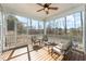 Relaxing screened porch with wood flooring and comfortable seating at 2901 Water Tower Ln, Apex, NC 27502