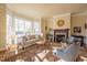 Bright living room features a cozy fireplace and large bay windows at 300 W Barbee Chapel Rd, Chapel Hill, NC 27517