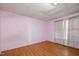 Pink walls, wood-look floors, and window with curtains at 307 N Hyde Park Ave, Durham, NC 27703