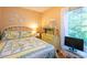 Bedroom with yellow bedding and a TV at 310 Edward Lane, Louisburg, NC 27549