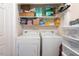 Laundry closet with washer, dryer, and shelving at 310 Edward Lane, Louisburg, NC 27549