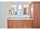 Double vanity bathroom with granite countertops and wood cabinets at 4034 S Mcdowell, Pittsboro, NC 27312