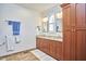 Double vanity bathroom with granite countertops and wood cabinets at 4034 S Mcdowell, Pittsboro, NC 27312