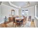 Bright dining room with hardwood floors and a large window at 4034 S Mcdowell, Pittsboro, NC 27312