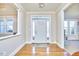 Bright entryway with hardwood floors and a star-shaped light fixture at 4034 S Mcdowell, Pittsboro, NC 27312