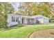 Gray house with a front porch and attached two-car garage at 4034 S Mcdowell, Pittsboro, NC 27312