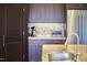 Kitchen detail showcasing granite countertops and stainless steel appliances at 4034 S Mcdowell, Pittsboro, NC 27312