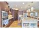 Gourmet kitchen with granite island, stainless steel appliances, and hardwood floors at 4034 S Mcdowell, Pittsboro, NC 27312
