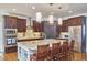 Spacious kitchen with granite countertops, stainless steel appliances, and an island at 4034 S Mcdowell, Pittsboro, NC 27312