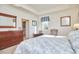 Bright main bedroom featuring a king-size bed and walk-in closet at 4034 S Mcdowell, Pittsboro, NC 27312