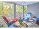 Spacious screened porch with comfortable seating and wooded views at 4034 S Mcdowell, Pittsboro, NC 27312