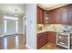 Elegant wet bar with wood cabinetry, wine storage, and beverage cooler at 4034 S Mcdowell, Pittsboro, NC 27312