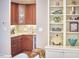 Convenient wet bar with granite countertop and wood cabinetry at 4034 S Mcdowell, Pittsboro, NC 27312