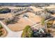 Aerial view of house, large lot, and nearby pond at 430 Federal Rd, Benson, NC 27504