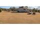 Expansive backyard featuring a home with stone accents and a gazebo on a clear day at 430 Federal Rd, Benson, NC 27504