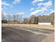 Asphalt basketball court with surrounding yard at 430 Federal Rd, Benson, NC 27504