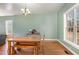 Charming dining room with hardwood floors and a wooden table with bench seating at 430 Federal Rd, Benson, NC 27504