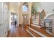 Bright and spacious entryway with hardwood floors and staircase at 430 Federal Rd, Benson, NC 27504