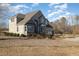 Beautiful brick home with manicured landscaping, a charming fountain and a circular driveway, offering curb appeal at 430 Federal Rd, Benson, NC 27504