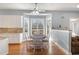 Kitchen with breakfast nook and white cabinets at 430 Federal Rd, Benson, NC 27504