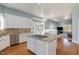 Open concept kitchen with large island, breakfast area and Gathering room view at 430 Federal Rd, Benson, NC 27504