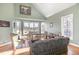 Spacious living room with hardwood floors, large windows, and ample natural light at 430 Federal Rd, Benson, NC 27504