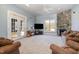 Living room with stone fireplace and hardwood floors at 430 Federal Rd, Benson, NC 27504